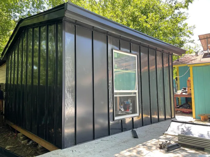 Black standing seam metal wall panels for Metal Roof Installation in Carterville